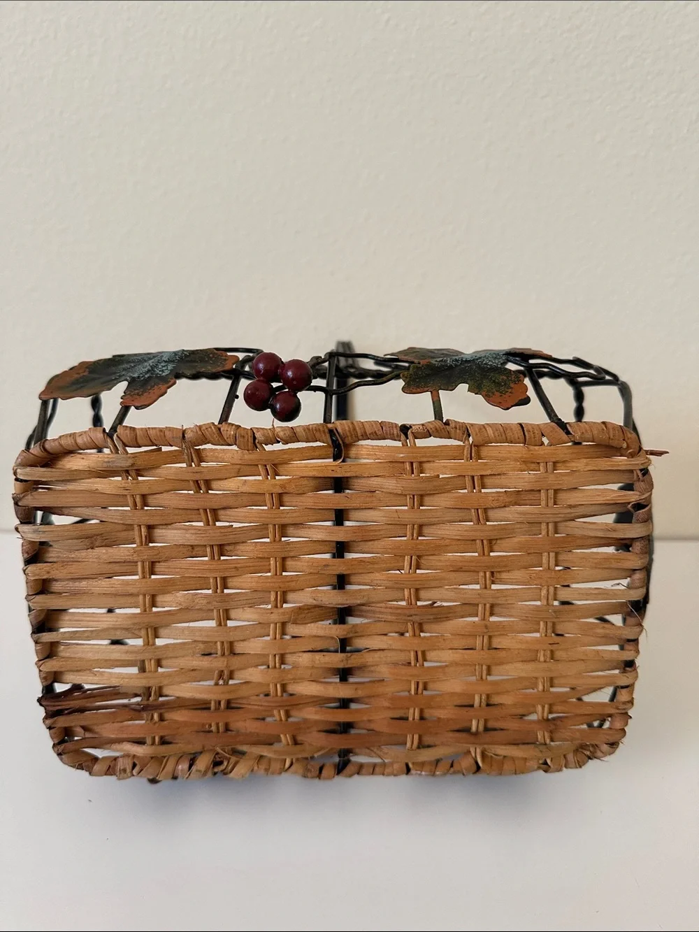 Black Metal and Brown Woven Decorative Basket with Green Leaf Accents